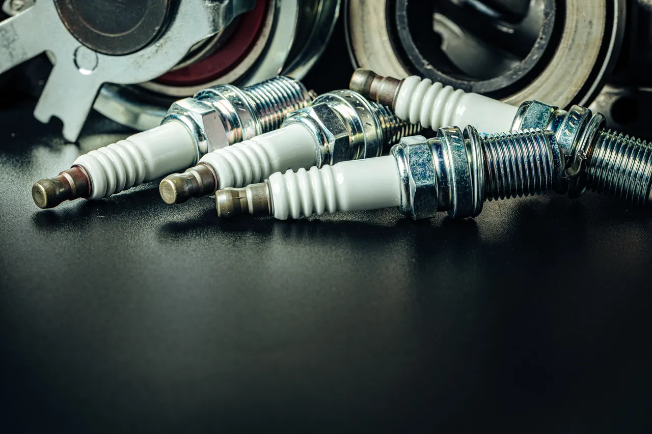 car-spark-plugs-on-black-background-close-up-2023-11-27-05-08-02-utc